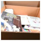 Assortment of Children's Books and Electronics