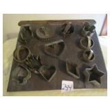 PRIMITIVE CUTTING BOARD ; 13 COOKIE CUTTERS