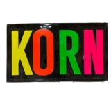 KORN Stamps Metal Embossed Sign