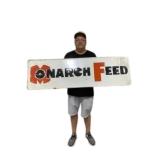 Monarch Feed Embossed Metal Sign