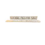 Two Wooden Pigs for Sale Signs