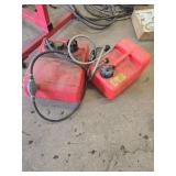 Two Red Plastic Boat Fuel Tanks