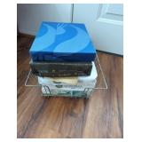 Stack of Paper Packs in Wire Basket