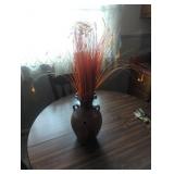 Carved ceramic Vase with Orange Stems