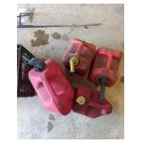 Four Plastic Gas Cans