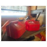Two Red Plastic Gasoline Containers