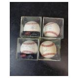 Four Autographed Baseballs in Cases