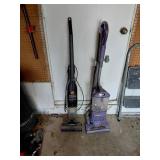 Two Upright Vacuum Cleaners
