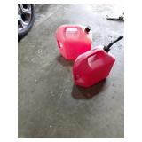 Two Red Plastic Gasoline Containers