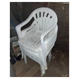 Six White Plastic Chairs