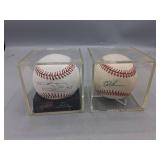 Two Signed Baseballs in Cases