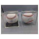 Two Autographed Baseballs in Cases