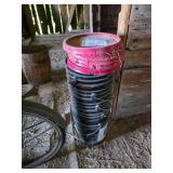 Stack of Black Buckets With Lids