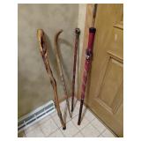 Four Carved Walking Sticks and Canes