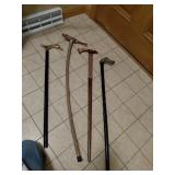 Four Carved Animal-Head Canes