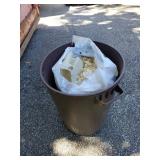 Plastic Trash Can with Wood Shavings