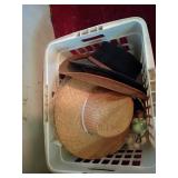 Straw and Felt Hats in Basket
