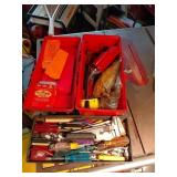 Red Toolbox With Hand Tools And Chain Saw