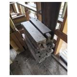 Stack of Reclaimed Wood Beams With Cutouts