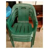 Four Green Plastic Stackable Chairs