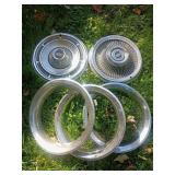 2 Cadillac Hubcaps and 3 Trim Rings