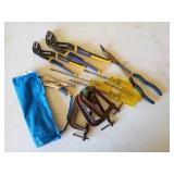 Collection of vise grips, screwdrivers, clamps