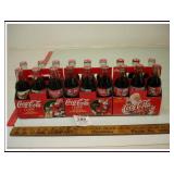 THREE COCA COLA SIX PACKS