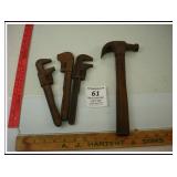 THREE PIPE WRENCHES AND A HAMMER