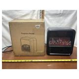 NEW IN BOX SMALL LIGHT UP FIREPLACE HEATER (WORKS)