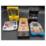 Collection of vintage handheld and mini arcade