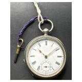 Waltham silver windup timepiece with key
