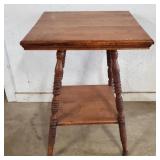 Vintage two-tier oak parlor table with turned