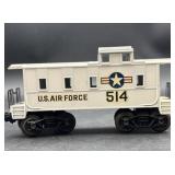 white U.S. Air Force caboose, likely a Lionel