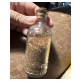 Old Listerine Bottle with Tobacco Seeds
