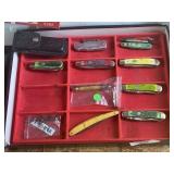 Display of 9 Collectible Pocket Knives