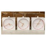 Three Small Clocks
