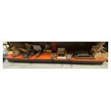 Misc on Bottom Shelf Of Orange Rack