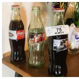 Three Collectible Coca-Cola Bottles