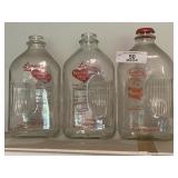 Three Glass Milk Bottles