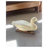 Decorative wooden duck on sled
