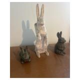 2 Cast iron rabbits and one taller one with