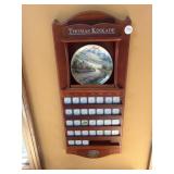 Thomas Kincaid calendar display , plates in boxes