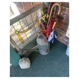 Sprinkling can with contents, umbrellas, canes,