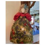 Decorative doll that holds plastic shopping bags