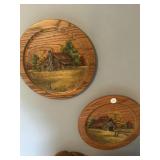 Wooden display plates with a barn and cabin