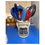 JW Riley crock with various spoons