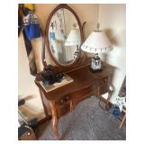 Dresser with oval framed mirror