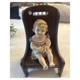Wooden chair and bisque doll