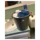 Metal bucket with towels