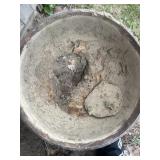 Cast iron kettle with a big oleï¿½ hole in the